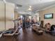 The gym is equipped with cardio machines, weights, and mirrored walls for a complete workout experience at 12125 Stonelake Ranch Blvd, Thonotosassa, FL 33592