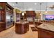 Gourmet kitchen with a large island, custom cabinets, stainless steel appliances, and tile floor at 12125 Stonelake Ranch Blvd, Thonotosassa, FL 33592