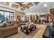 Spacious living area with coffered ceiling, open floor plan, and seamless flow to kitchen at 12125 Stonelake Ranch Blvd, Thonotosassa, FL 33592