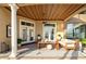 Inviting outdoor patio with stylish seating, ceiling fan, and serene lake views at 12125 Stonelake Ranch Blvd, Thonotosassa, FL 33592