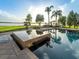 Stunning pool area with a hot tub and scenic waterfront views, perfect for relaxation and entertaining at 12125 Stonelake Ranch Blvd, Thonotosassa, FL 33592