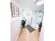 Updated bathroom with decoratively tiled walls, a modern shower, and wood-look flooring at 1300 21St S St, St Petersburg, FL 33712