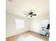 Bright bedroom showcasing wood-look floors, white walls, and a decorative blue cabinet at 1300 21St S St, St Petersburg, FL 33712
