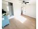 Sunlit bedroom with wood floors, mirrored closet doors, and a neutral color palette at 1300 21St S St, St Petersburg, FL 33712