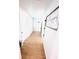Hallway with modern flooring leading to rooms with black hardware at 1300 21St S St, St Petersburg, FL 33712