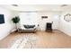 Cozy living room with a soft gray couch, accent chair, modern decor, and a decorative rug at 1300 21St S St, St Petersburg, FL 33712