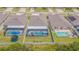 Aerial view showcasing backyards with screened pools in a well-maintained residential neighborhood at 13527 Willow Bluestar Loop, Riverview, FL 33579
