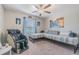 Comfortable bedroom with a daybed, massage chair, ceiling fan, and natural light from a window at 13527 Willow Bluestar Loop, Riverview, FL 33579