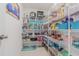 Well-organized pantry with wire shelving, showcasing ample storage space for food and essentials at 13527 Willow Bluestar Loop, Riverview, FL 33579