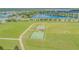 Aerial view of community park offering basketball, exercise, and playground for outdoor recreation at 13527 Willow Bluestar Loop, Riverview, FL 33579