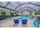 Enclosed pool area with seating offering relaxation and recreation in a private setting at 13527 Willow Bluestar Loop, Riverview, FL 33579