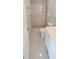 Bright bathroom showcasing a stylish walk-in shower with a marble-patterned wall at 1407 Coral Ridge Dr, Punta Gorda, FL 33950