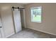 Charming bedroom features a sliding door closet, tile floor, and sunlit window at 1407 Coral Ridge Dr, Punta Gorda, FL 33950