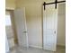 Bright bedroom with a sliding closet door and tile floors at 1407 Coral Ridge Dr, Punta Gorda, FL 33950