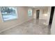 Bright living room with tile floors and large windows at 1407 Coral Ridge Dr, Punta Gorda, FL 33950