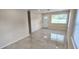 Inviting living room featuring sleek tile flooring, neutral paint, and a bright, airy atmosphere at 1407 Coral Ridge Dr, Punta Gorda, FL 33950