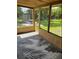 Screened patio showcasing outdoor seating and views of the green backyard at 1407 Coral Ridge Dr, Punta Gorda, FL 33950