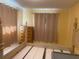 Bedroom featuring natural lighting, wooden trim and a neutral wall color at 1480 Fairfield Dr, Clearwater, FL 33764