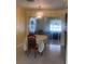 Cozy dining area featuring a classic chandelier and view into office space at 1480 Fairfield Dr, Clearwater, FL 33764