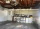Functional garage featuring shelving and storage solutions, perfect for organization and workspace at 1480 Fairfield Dr, Clearwater, FL 33764