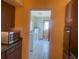 View from kitchen into a combined laundry and bathroom with a side door to the backyard at 1480 Fairfield Dr, Clearwater, FL 33764