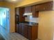 Functional kitchen featuring classic cabinets, a built-in oven, and laminate countertops at 1480 Fairfield Dr, Clearwater, FL 33764