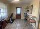 Living room featuring tile flooring, neutral-colored walls, and natural light at 1480 Fairfield Dr, Clearwater, FL 33764