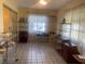 Living room featuring tile flooring, natural light, and neutral-colored walls at 1480 Fairfield Dr, Clearwater, FL 33764