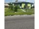 Charming single-Gathering home with mature landscaping, solar panels, and a cozy front entrance at 1557 15Th S St, St Petersburg, FL 33705