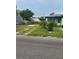 Single-Gathering home with a partially fenced yard and potential for landscaping upgrades and parking at 1557 15Th S St, St Petersburg, FL 33705