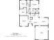 Detailed floor plan showcasing layout of the home, including two bedrooms, kitchen, living spaces, and garage at 1675 E Grovehill Rd, Palm Harbor, FL 34683