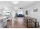 Open-concept living and dining area with modern furnishings and a bright, airy atmosphere at 1675 E Grovehill Rd, Palm Harbor, FL 34683