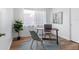 Bright office space with sleek desk, comfortable chairs, and a decorative rug at 1675 E Grovehill Rd, Palm Harbor, FL 34683
