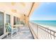 Enjoy breathtaking ocean views and sea breezes from this spacious balcony, complete with stylish seating and coastal decor at 17720 Gulf Blvd # A702, Redington Shores, FL 33708