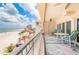 Spacious outdoor balcony featuring beach views, lounge chairs, and tables perfect for entertaining guests at 17720 Gulf Blvd # A702, Redington Shores, FL 33708