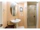 Bathroom vanity with updated sink and a glass-enclosed shower at 17720 Gulf Blvd # A702, Redington Shores, FL 33708