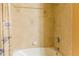 Bathroom shower and tub with tile surround and shower curtain at 17720 Gulf Blvd # A702, Redington Shores, FL 33708