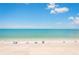 Beautiful beach view with turquoise water and a sandy shore on a sunny day at 17720 Gulf Blvd # A702, Redington Shores, FL 33708