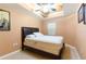 Cozy bedroom featuring a ceiling fan, tray ceiling, and a comfortable bed at 17720 Gulf Blvd # A702, Redington Shores, FL 33708