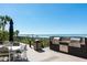 Community grilling area with outdoor seating features stainless steel grills and ocean views at 17720 Gulf Blvd # A702, Redington Shores, FL 33708