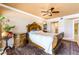 Comfortable main bedroom featuring a ceiling fan, ensuite bathroom, and traditional-style furniture at 17720 Gulf Blvd # A702, Redington Shores, FL 33708