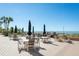 Outdoor seating with tables and chairs offers gorgeous beach views and community grills at 17720 Gulf Blvd # A702, Redington Shores, FL 33708