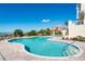 Beautiful community pool with beach views, lounge chairs and lovely landscaping surrounding the deck at 17720 Gulf Blvd # A702, Redington Shores, FL 33708