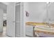 Bathroom featuring a tiled floor, vanity with drawers, and wall-mounted mirror at 1811 49Th N St, St Petersburg, FL 33710