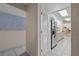Bright hallway featuring tile flooring, neutral paint colors and easy access to the kitchen and pantry at 1811 49Th N St, St Petersburg, FL 33710