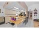 Open-concept kitchen with wood breakfast bar, light cabinetry and modern appliances at 1811 49Th N St, St Petersburg, FL 33710
