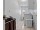 Convenient laundry area with washer, dryer, utility sink, and access to the backyard at 1811 49Th N St, St Petersburg, FL 33710
