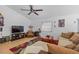 Bright living room featuring wood flooring, neutral color scheme, and a ceiling fan at 1811 49Th N St, St Petersburg, FL 33710