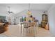 Bright and spacious living room featuring laminate flooring, a ceiling fan, and sliding glass doors to the patio at 1811 49Th N St, St Petersburg, FL 33710