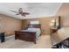 Spacious bedroom features a ceiling fan, neutral paint, and tiled floors at 1811 49Th N St, St Petersburg, FL 33710